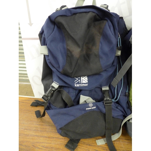 2230 - A quantity of camping gear including 3 ruck sacks (1 x 65L, 1 x 60L and one other), a sleeping bag, ... 