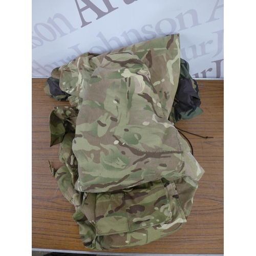 2239 - A Vango NYX200 tent and a quantity of army clothing including coats, boots, vests, etc.