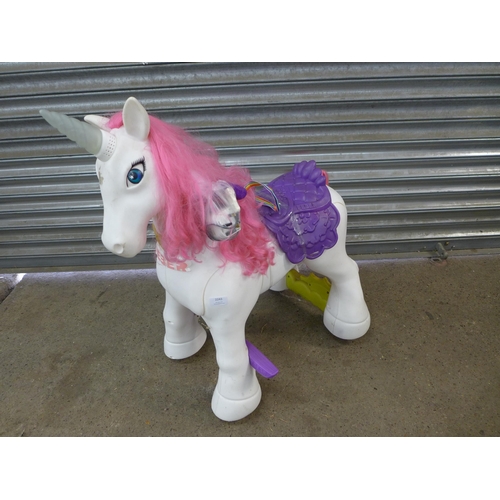 2243 - A childs Feber 12v battery operated ride on unicorn with charging cable