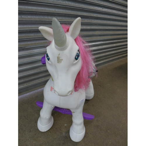 2243 - A childs Feber 12v battery operated ride on unicorn with charging cable