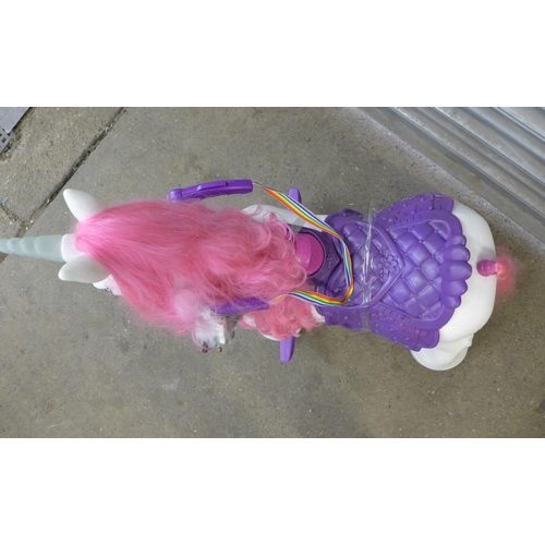 2243 - A childs Feber 12v battery operated ride on unicorn with charging cable