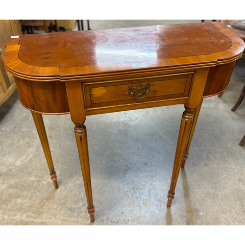 128 - A Regency style yew wood single drawer hall table