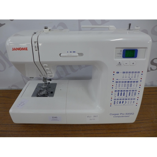 2245 - A Janome Cooper 5000Q, 220-240V sewing machine (no power supply) and extension table in box