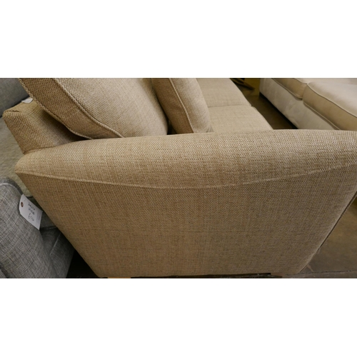 1422 - A gold weave three seater sofa - brand new