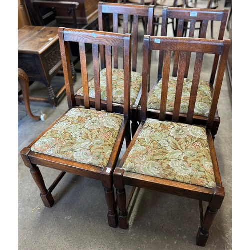 136 - A set of four early 20th Century oak dining chairs