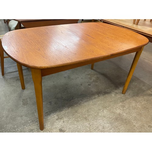 57 - A teak extending dining table