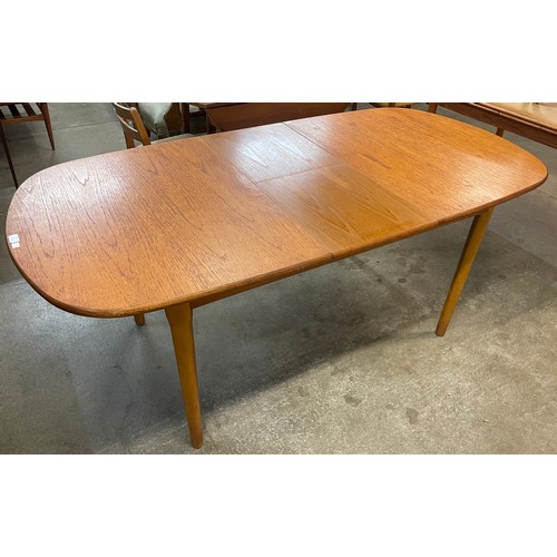 57 - A teak extending dining table