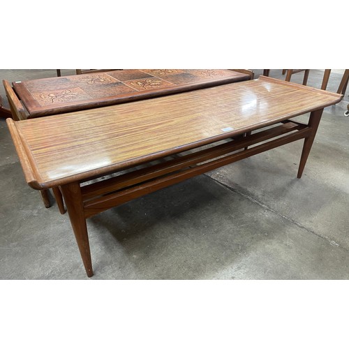 55 - A teak and Formica sleigh topped coffee table and a teak and tiled top coffee table