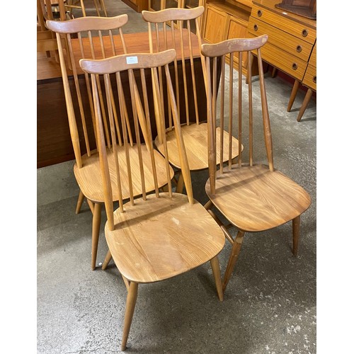 64 - A set of four Ercol Blonde elm and beech Goldsmith chairs