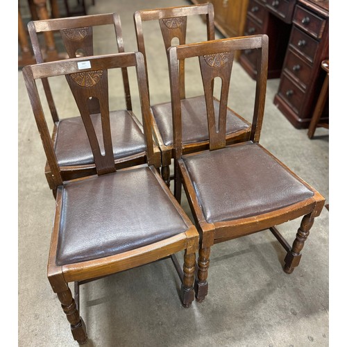 160 - A set of four early 20th Century oak dining chairs