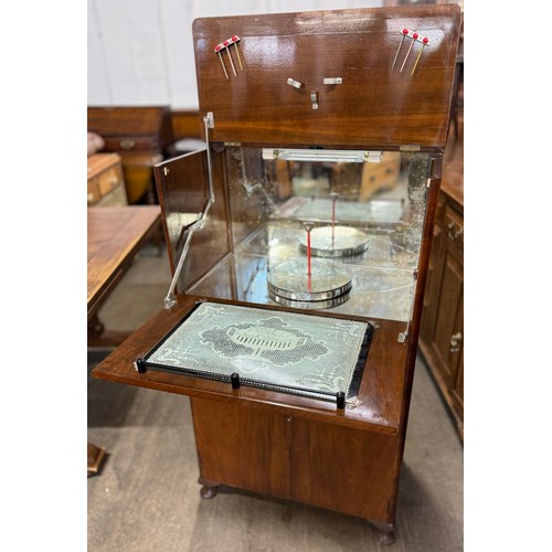 129 - An early 20th Century walnut cocktail cabinet