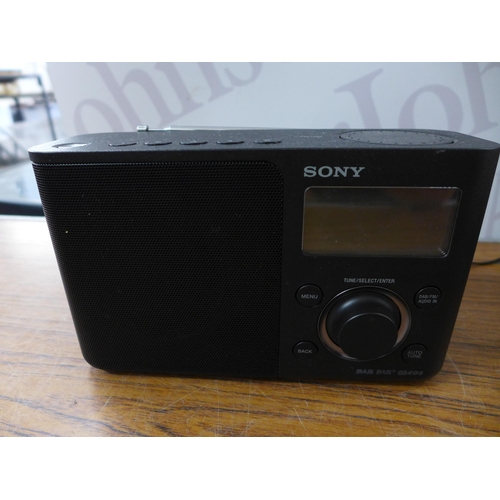 2100 - A quantity of assorted radios including a Sandstrom retro style Bluetooth DAB radio, an Asda DAB+ ra... 