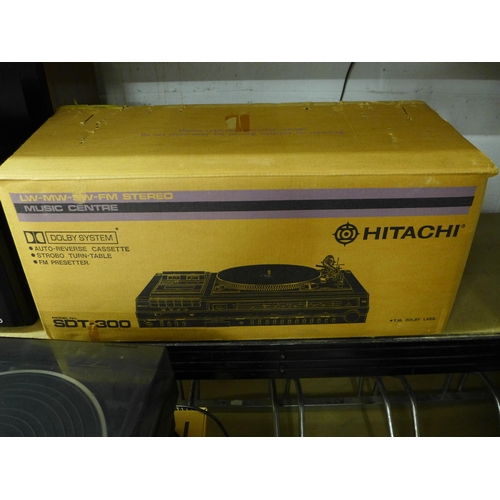 2102 - An Hitachi SDT-300 music centre and a Kenwood midi hifi stacking system comprising P-42 turntable, G... 