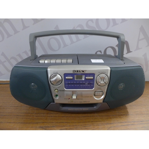 2103 - A quantity of assorted radios including a Sony CFD-V7 CD radio cassette-corder, a Roberts Revival Un... 