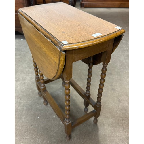 163 - A small oak barleytwist gateleg table