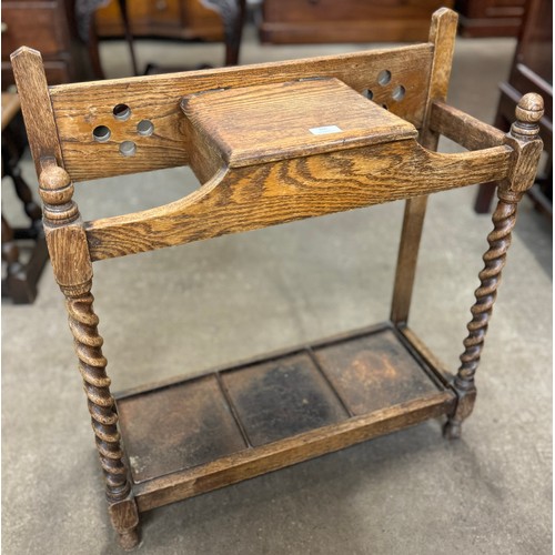 165 - An early 20th Century carved barleytwist oak stick stand