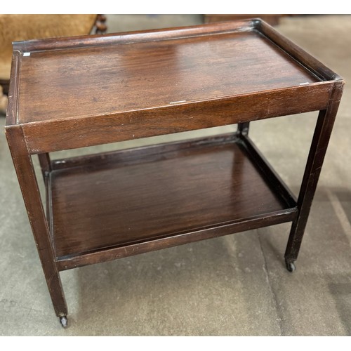 168 - A mahogany two tier trolley, marked XWD