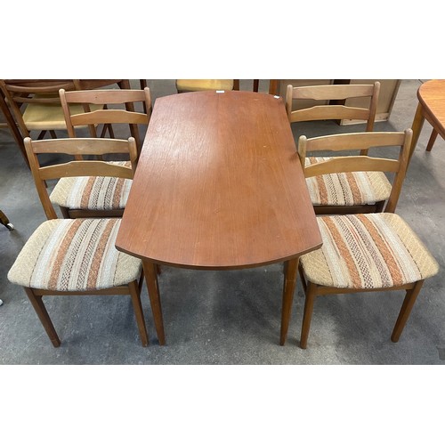 76 - A teak drop leaf table and four chairs