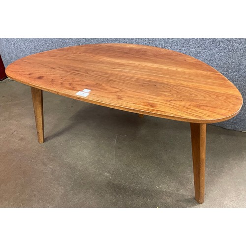 78 - A teak pebble shaped coffee table