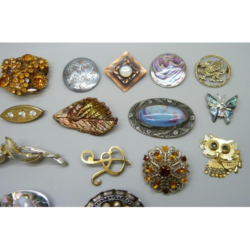 1019 - Costume brooches including one set with a Ruskin style but lacking fastening hook