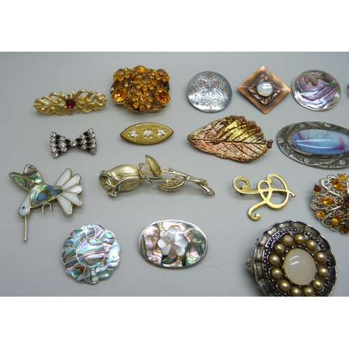 1019 - Costume brooches including one set with a Ruskin style but lacking fastening hook