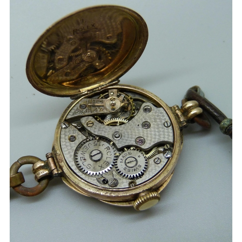 1039 - A 9ct gold cased Rolex wristwatch, the dial, movement and case marked Rolex, the case bears inscript... 