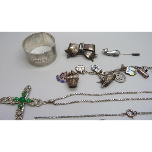 1044 - A silver charm bracelet, other silver jewellery, costume jewellery and a silver napkin ring, (90g of... 