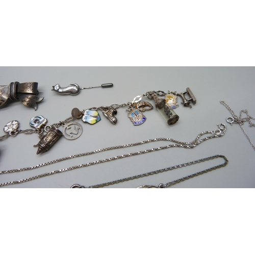 1044 - A silver charm bracelet, other silver jewellery, costume jewellery and a silver napkin ring, (90g of... 