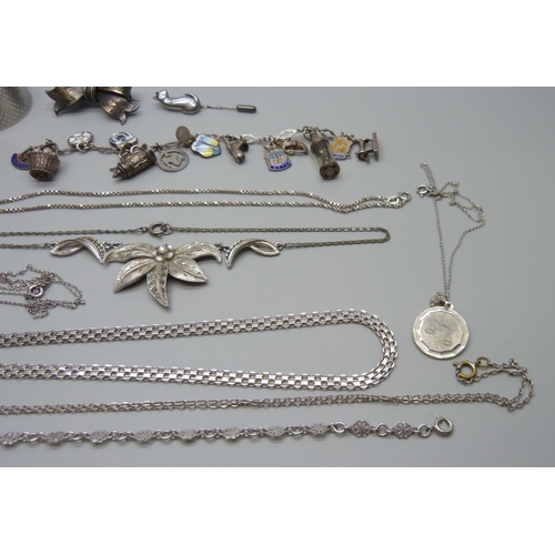 1044 - A silver charm bracelet, other silver jewellery, costume jewellery and a silver napkin ring, (90g of... 