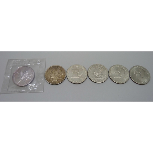 1047 - A 1922 silver dollar, a 1989 Maple Leaf 1oz silver coin, (pure), sealed mint pack, and four Eisenhow... 