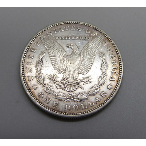 1058 - A 1879 silver US 'Morgan Dollar' one dollar coin