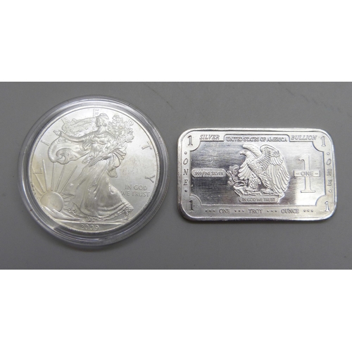 1061 - A 2009 United States 1oz. fine silver one dollar coin and a one Troy ounce .999 fine silver ingot