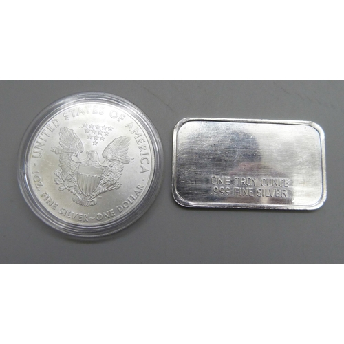 1061 - A 2009 United States 1oz. fine silver one dollar coin and a one Troy ounce .999 fine silver ingot