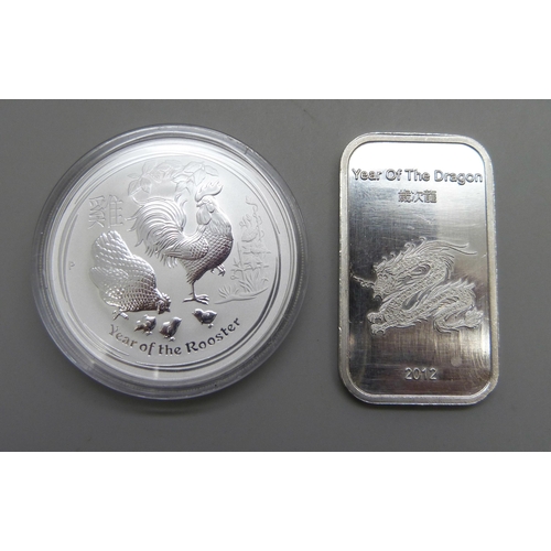 1062 - A 2017 silver proof 1oz. 9999 fine silver Year of the Rooster 1 dollar coin, Perth mint, and a 2012 ... 