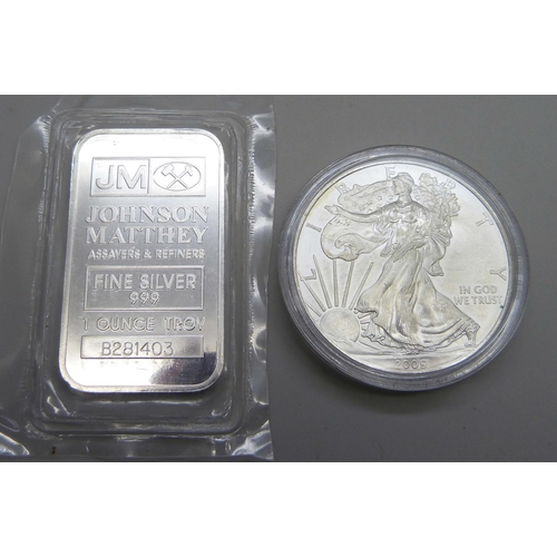 1063 - A 2009 United States 1oz. fine silver eagle one dollar coin and a 999 fine silver 1 Troy ounce bar