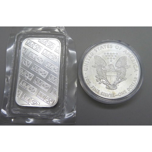 1063 - A 2009 United States 1oz. fine silver eagle one dollar coin and a 999 fine silver 1 Troy ounce bar