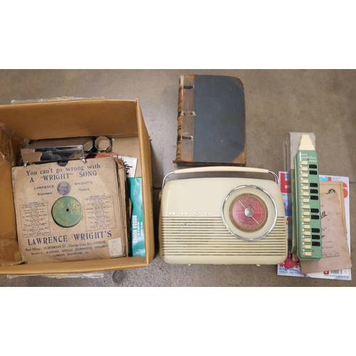 1100 - A box of assorted items including plated ware, 78rpm records, a Bush radio, a Hohner Melodica, etc. ... 