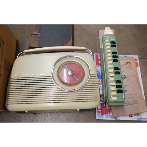 1100 - A box of assorted items including plated ware, 78rpm records, a Bush radio, a Hohner Melodica, etc. ... 