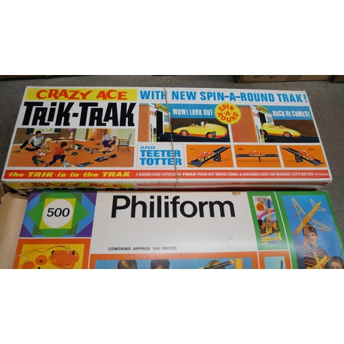 1103 - Toys; a Crazy Ace Trik-Trak, Philiform 500 set, Britains riding stable and Hugo Boss r/c car, all bo... 