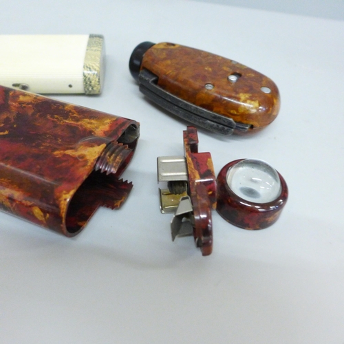 619 - A WWII period Bakelite cased dynamo torch (seen working) and two other torches, one marked Grosvenor... 