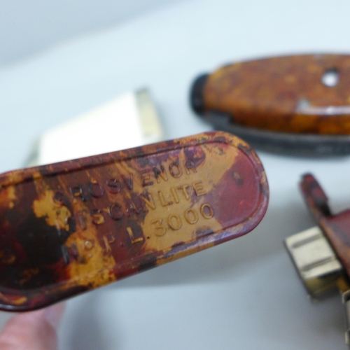 619 - A WWII period Bakelite cased dynamo torch (seen working) and two other torches, one marked Grosvenor... 