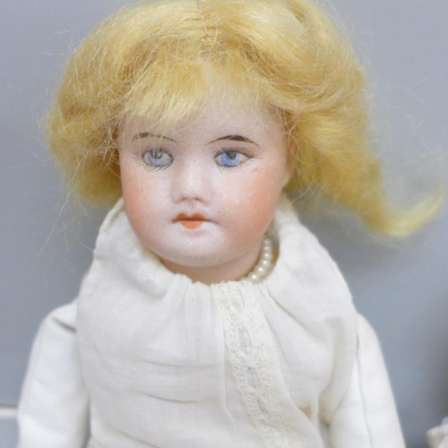 637 - A French SFBJ Paris bisque head doll and two Armand Marseille 390 bisque head dolls