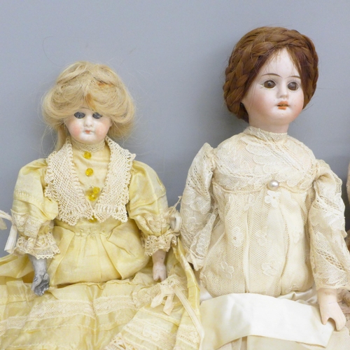 649 - Four bisque head dolls including German