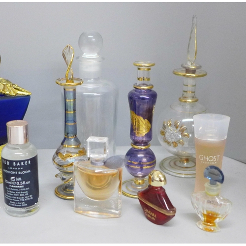 652 - A collection of perfume bottles, some containing perfume including La Vie est Belle miniature