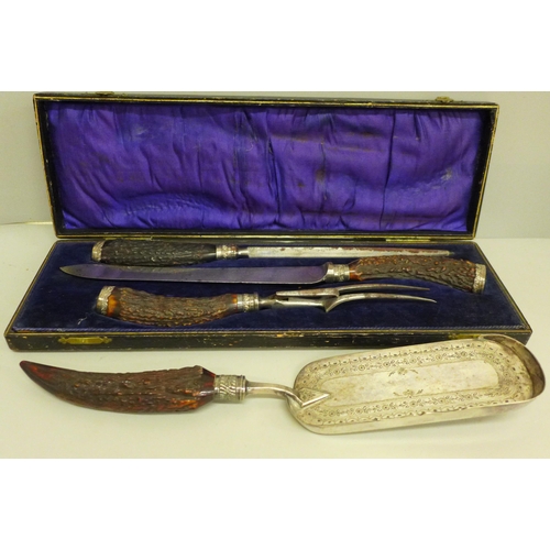 662 - A Robinson & Gates deer antler and silver mounted carving set, boxed and an antler handled crumb sco... 