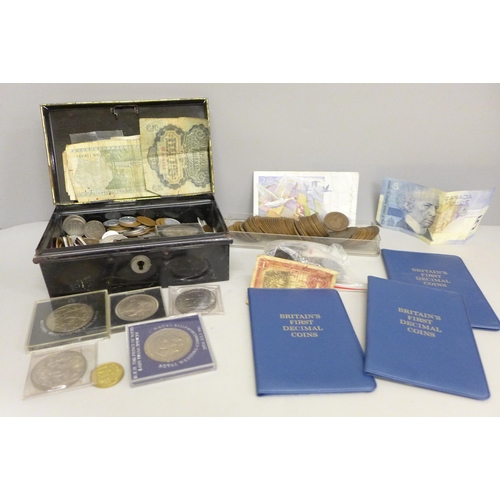 670 - A collection of British and foreign coins, a bronze medallion, commemorative crowns and banknotes