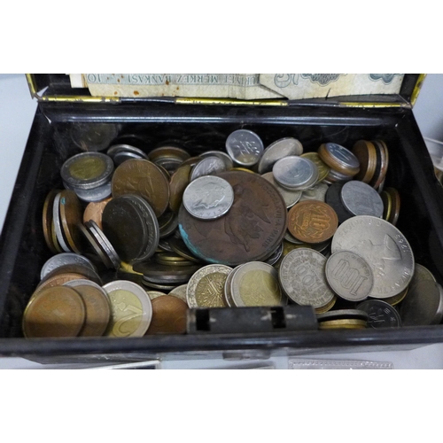 670 - A collection of British and foreign coins, a bronze medallion, commemorative crowns and banknotes