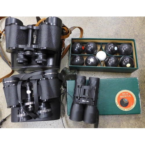 700 - Three pairs of binoculars including USSR and Greenkat, an indoor bowls set and a box of Ladybird and... 