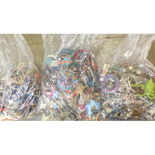 713 - Three bags of costume jewellery