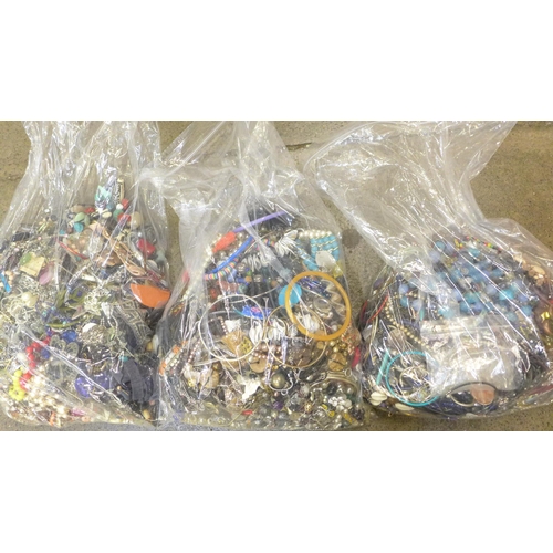 713 - Three bags of costume jewellery